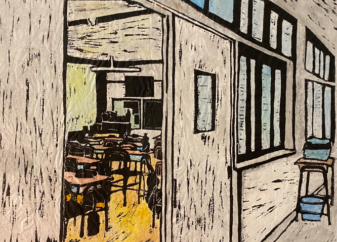 coloured in lino print looking inside the door of a classroom.  You can see desks and chairs, a monitor and fan.
