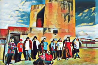 Students stand in front of Shepherd’s Hill fort in Newcastle. The image has a colourful paint filter applied.