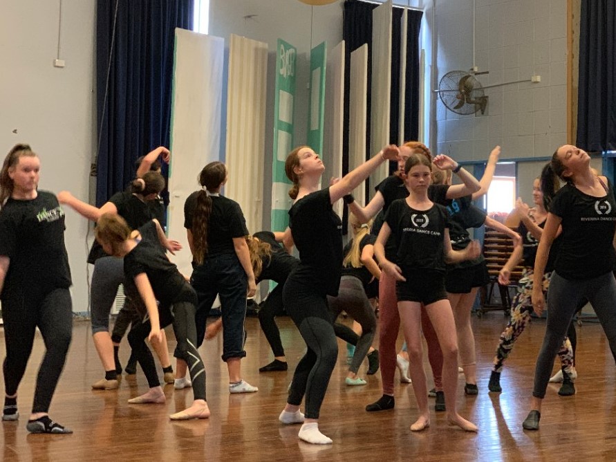 group of dancers participating in dance workshop as part of study day wearing dance blacks