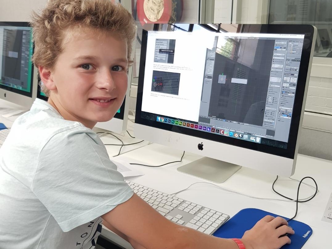 Boy working on computer using artmaking software