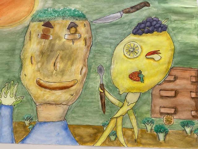 student painting of 2 faces with foods for face features.  one has a banana body, lemon head, sushi eyes, strawberry mouth, grapes for hair.  the other a potato head, saugage mouth and cheese eyes.