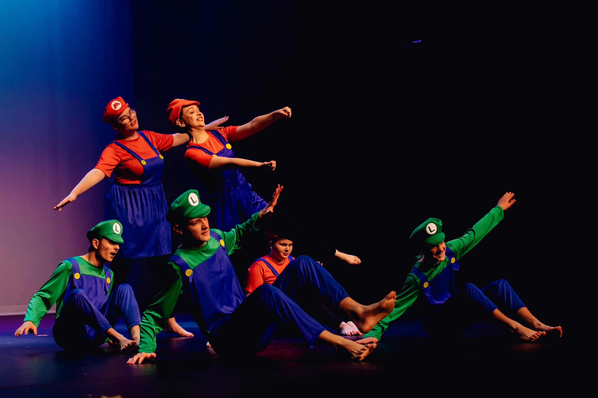 Wagga Wagga High School Learning Support students dressed as characters from Mario Brothers  with arms out stretched and leaning to the side