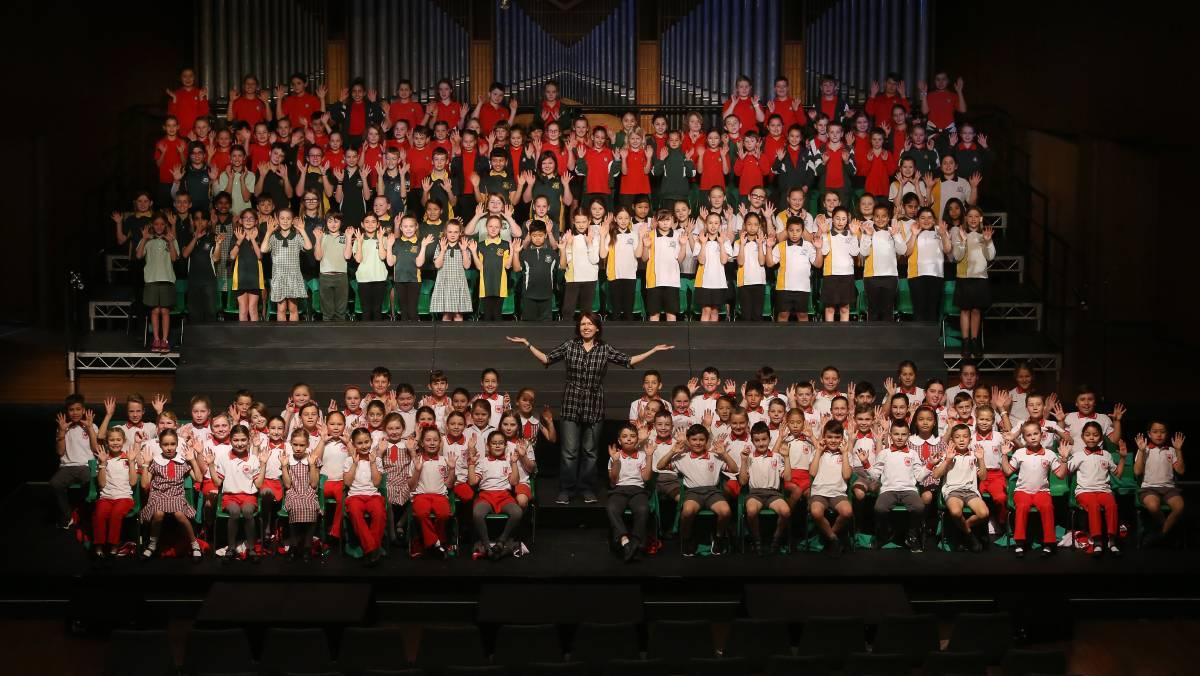 Massed choir standing on stage at festival