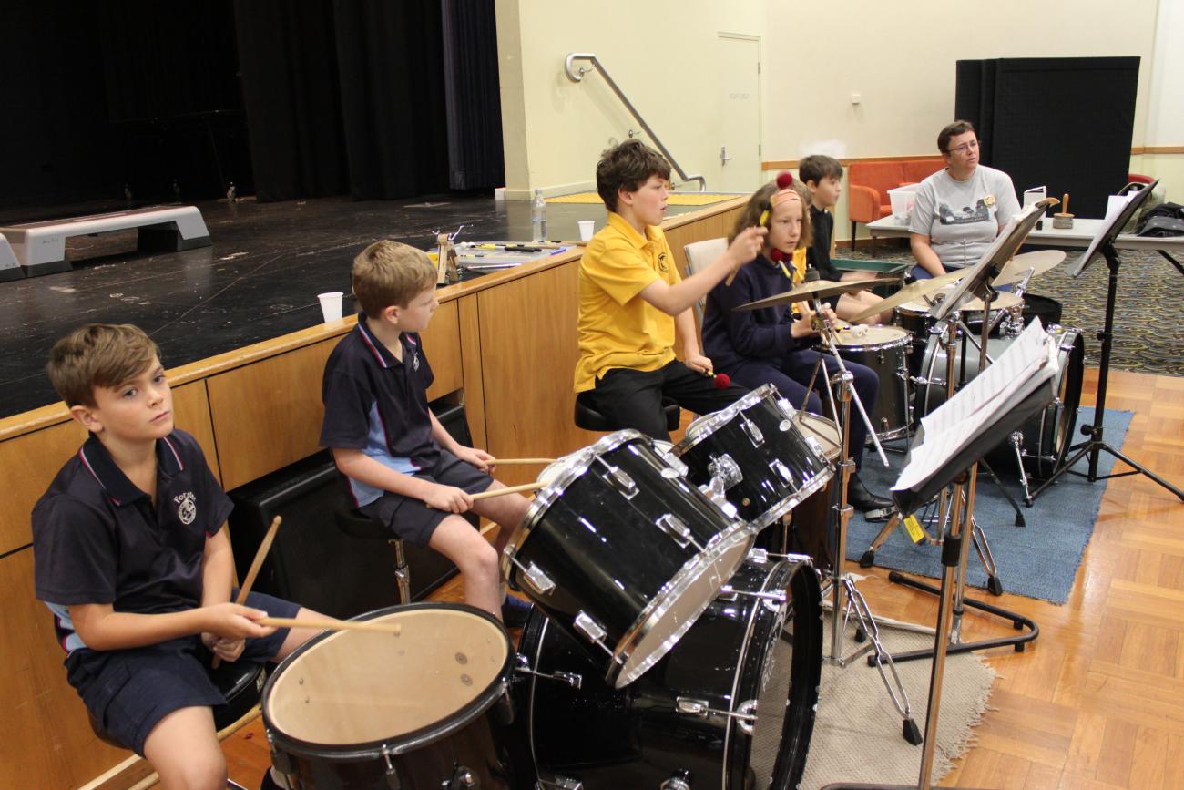 group of student drummers rehearsing as part of workshop