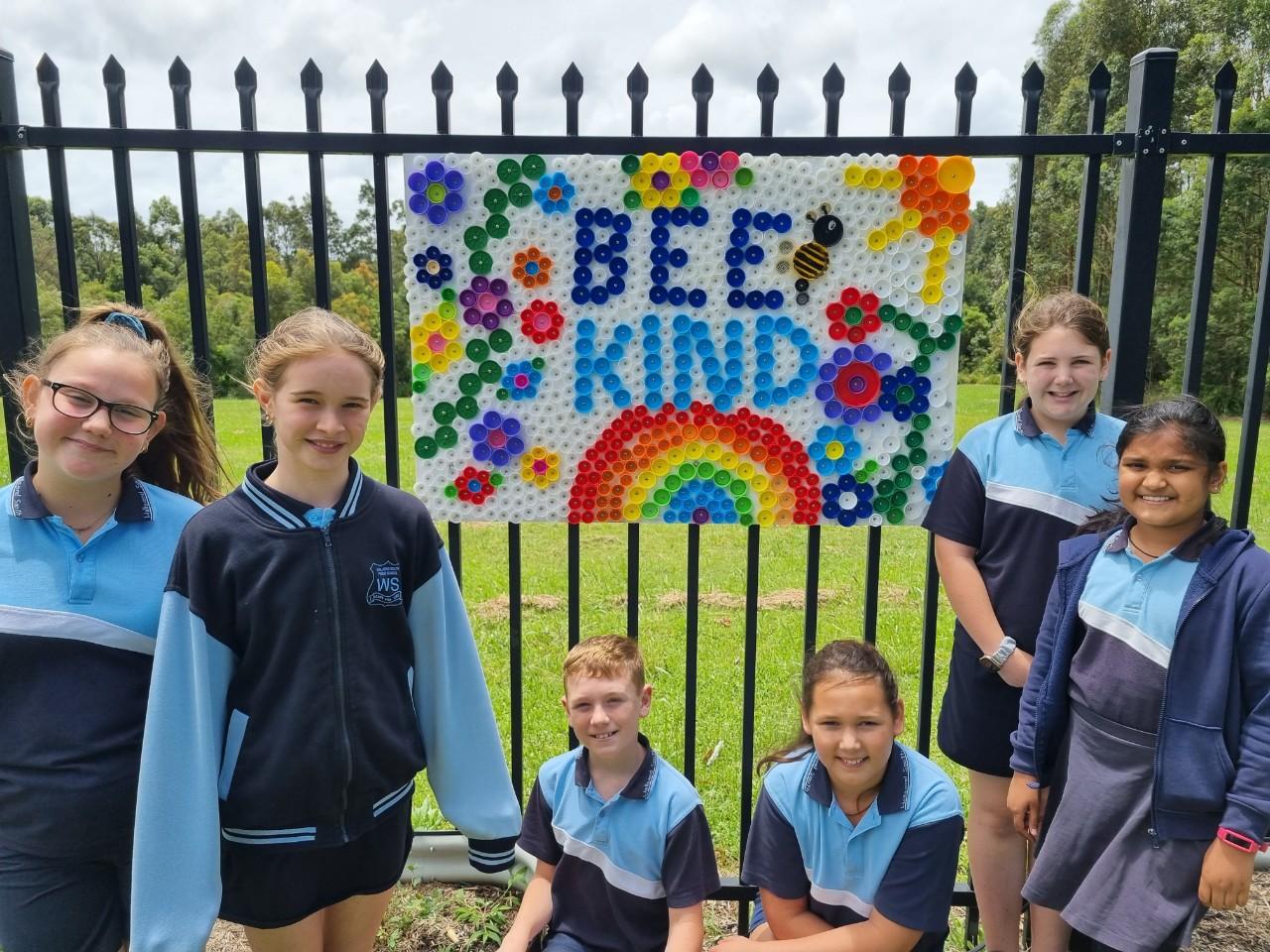 Students of Wallsend South Public School with their artwork Bee Kind
