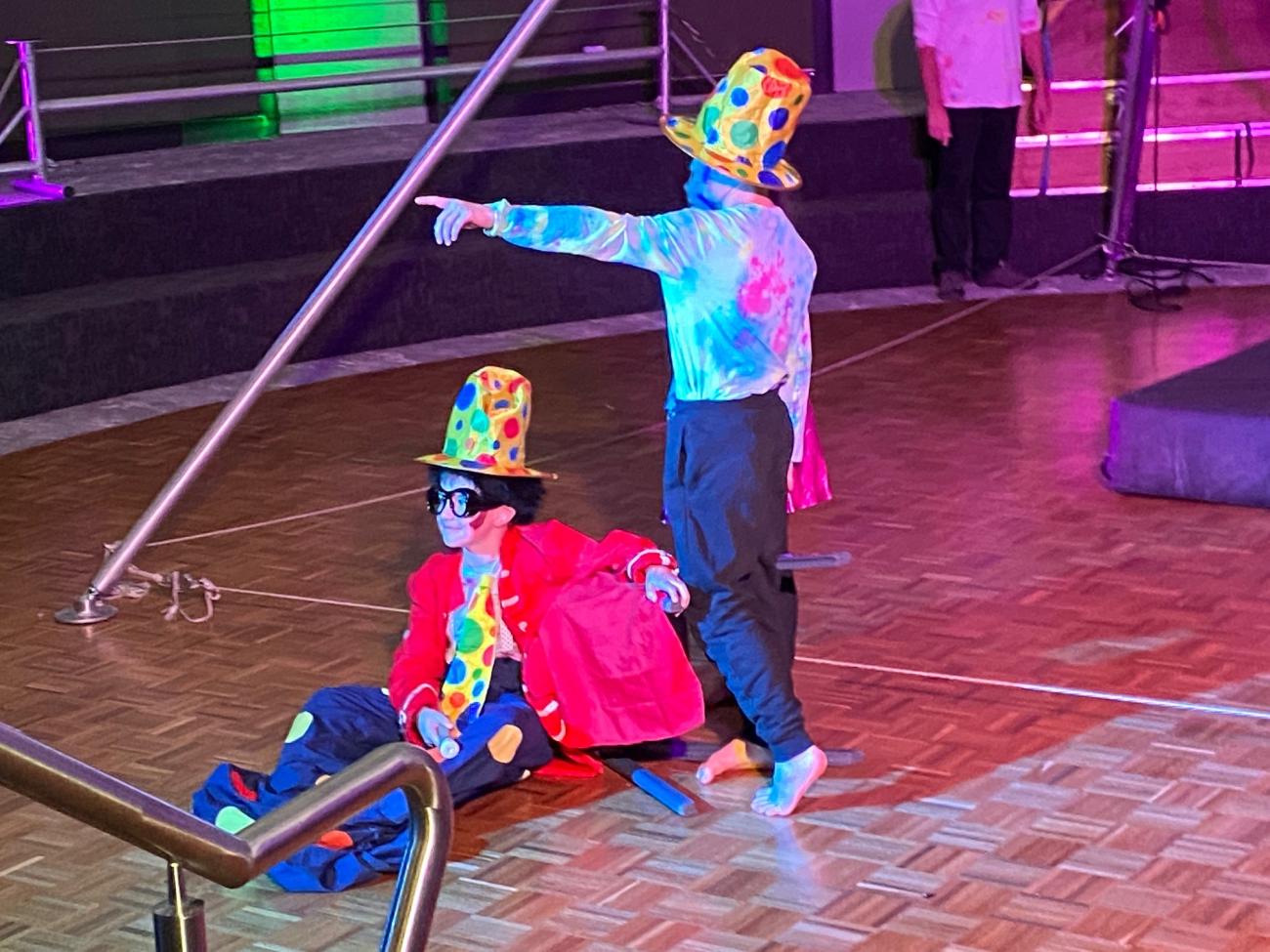 2 students dressed as clowns performing at camp showcase