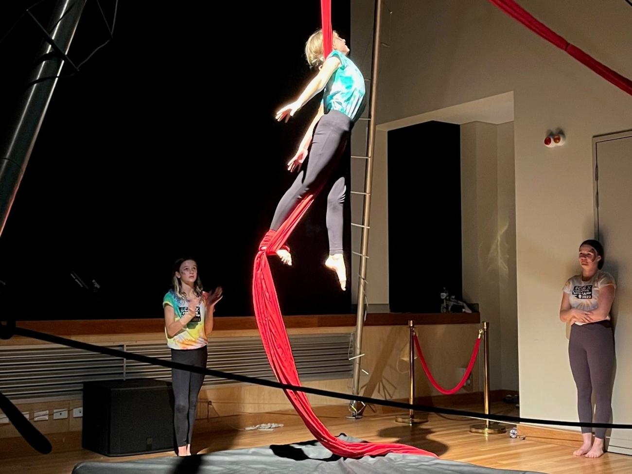 student performing on circus silks