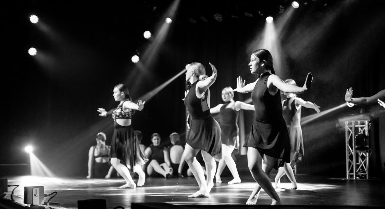 High school students dancing in black and white image