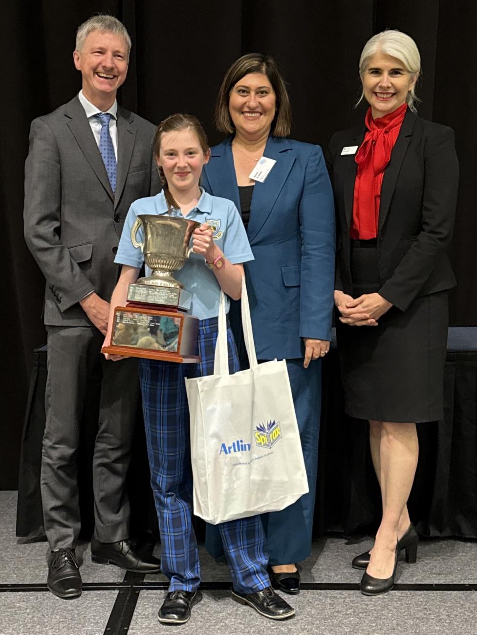 The winner receives her prizes