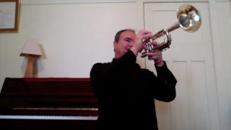 Craig Mitten playing a trumpet