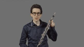 Johnathan Ryan holding an oboe