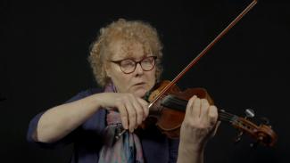 Leigh Middenway playing a violin
