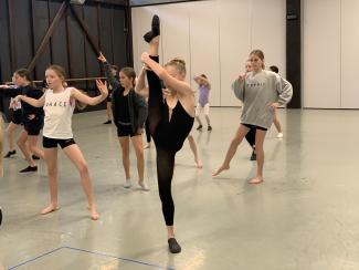 Dancer holding high leg extension