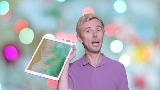 David Todd holding up an iPad
