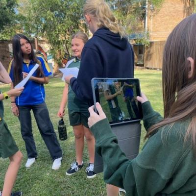 A group of students filming their scripts