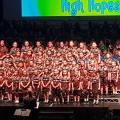 school choral group performing on stage at festival