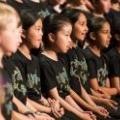 A row of students singing in the Combined Primary Choir.