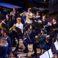 State Wind Band students in their various school uniforms playing on The Opera House Stage.