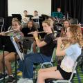 Children playing musical instruments in the camp concert band